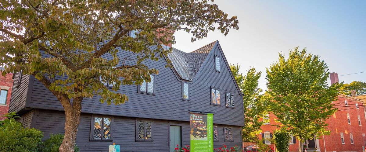 Witch House featuring a small town or village and signage
