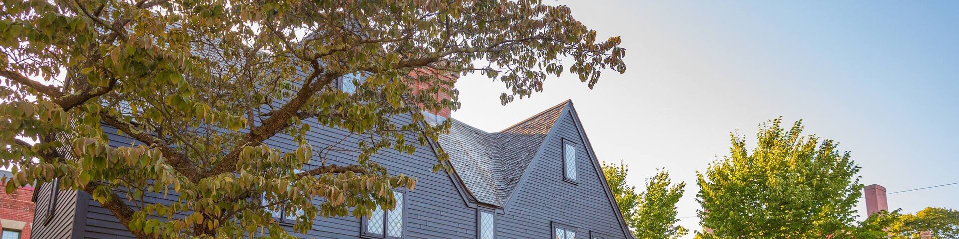 Witch House featuring a small town or village and signage