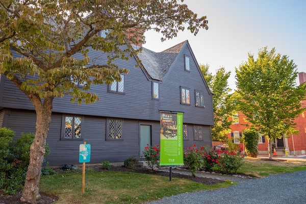 Witch House featuring a small town or village and signage