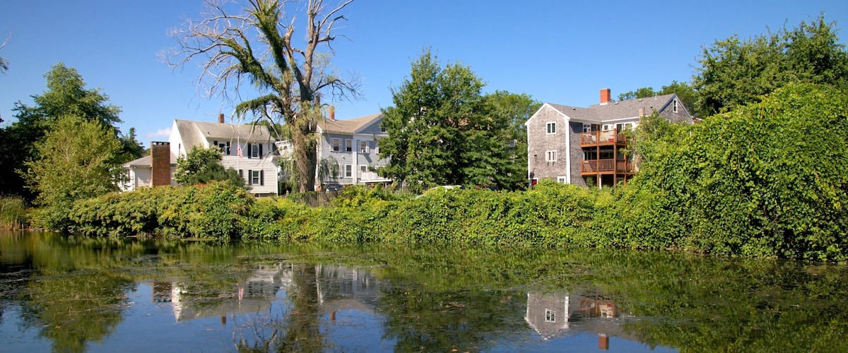 Jenney Grist Mill showing a house and a river or creek