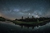 A panorama of Milky Way over the lake and reflections of the stars. A beautiful spot for camping and gazing at stars on a dark night. Near San Diego, California