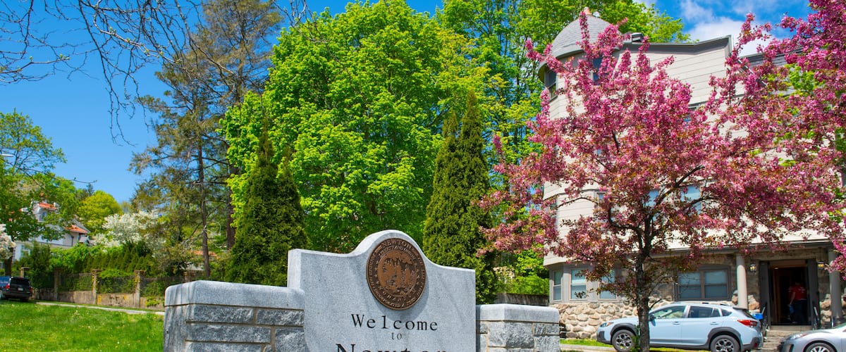 Welcome to Newton sign in spring on Commonwealth Avenue in Chestnut Hill, city of Newton, Massachusetts MA, USA.
