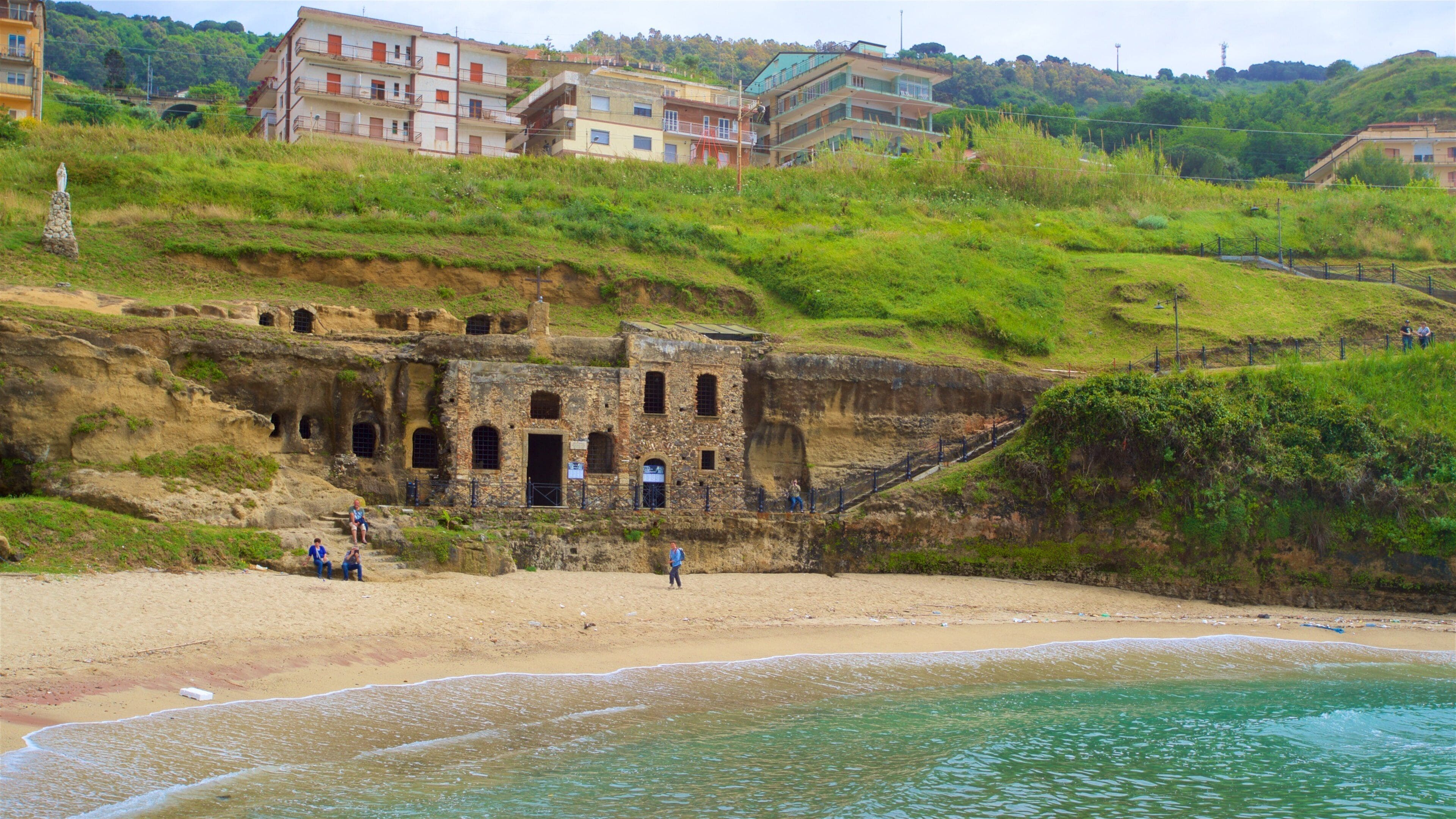 Piedigrotta Church featuring heritage elements, building ruins and general coastal views