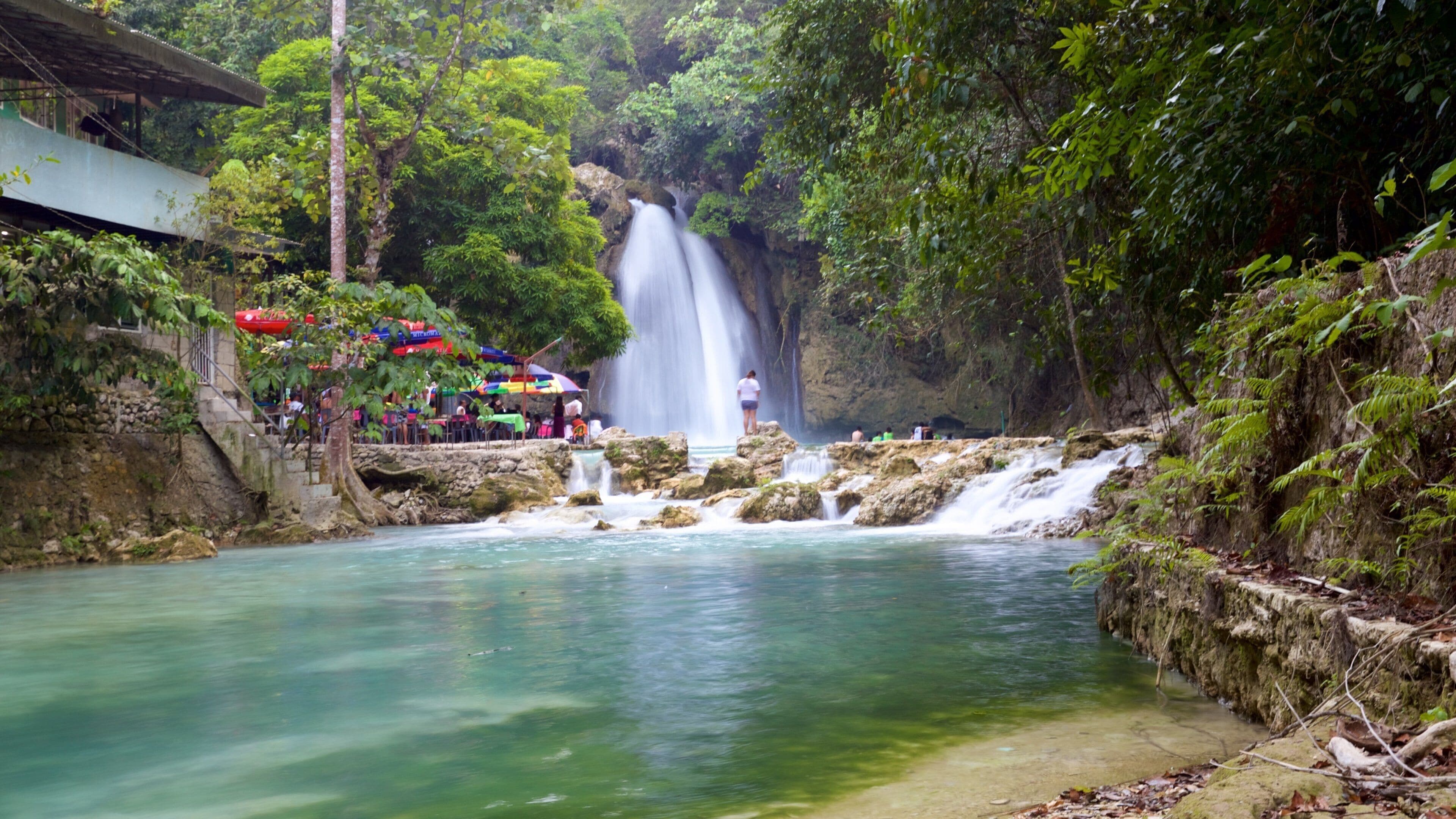 Kawasan Falls featuring a lake or waterhole and a cascade