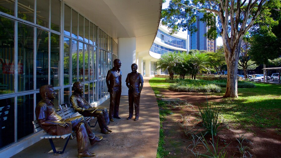 Biblioteca Publica Estadual Luiz de Bessa which includes a park, a statue or sculpture and outdoor art