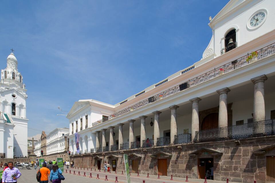 A historic building with columns and a clock tower.