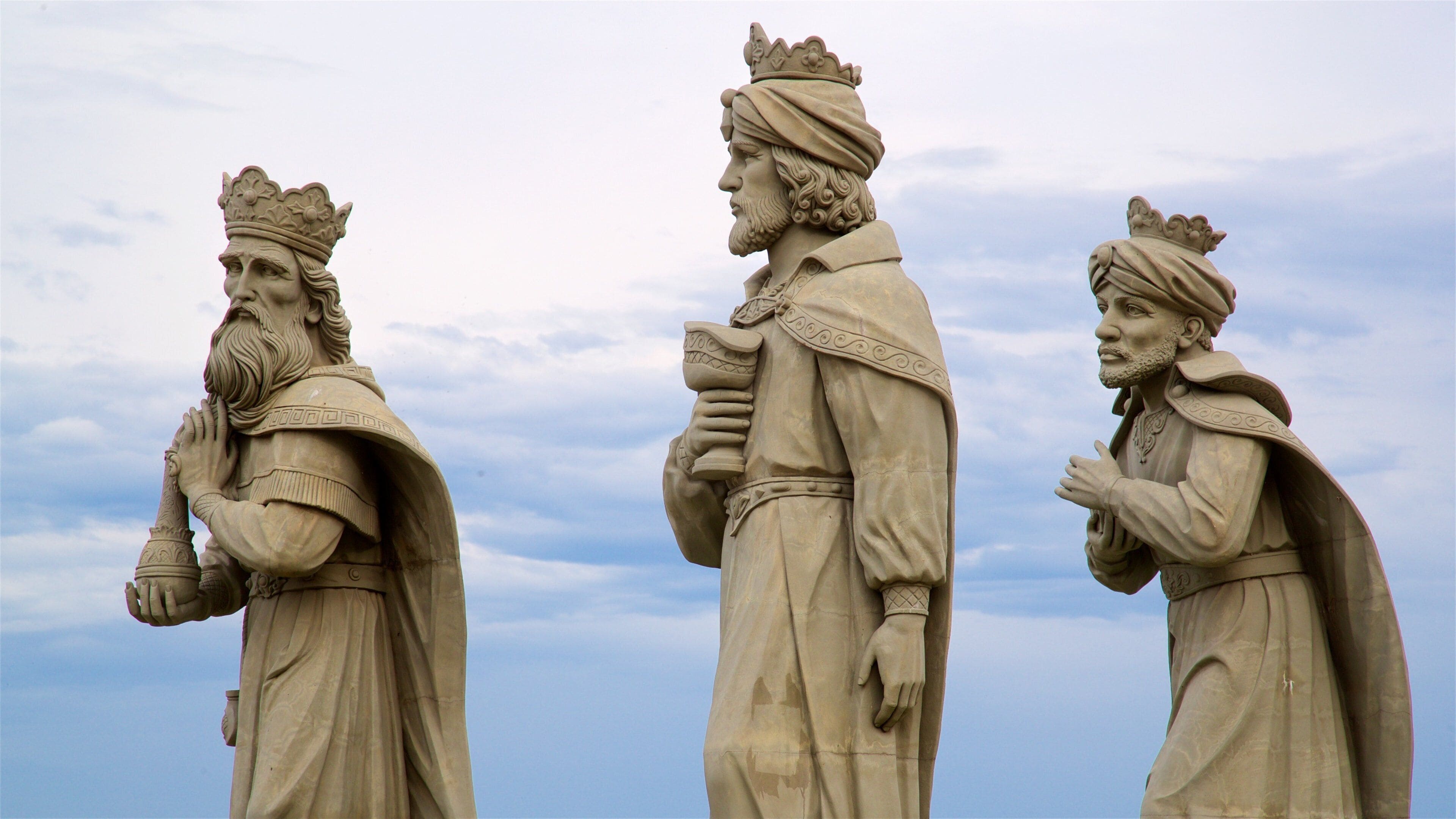 Anil Beach which includes a statue or sculpture and religious elements