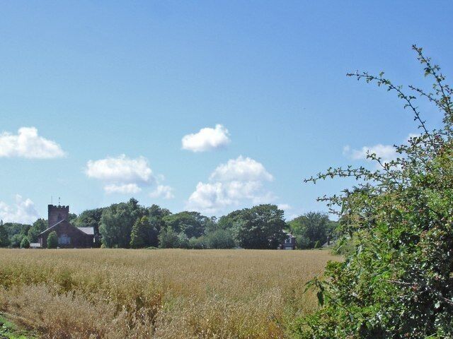 View west across a field to St Mary's parish church, Hale, Merseyside. The view is from the Within Way, a footpath that is part of the Mersey Way.