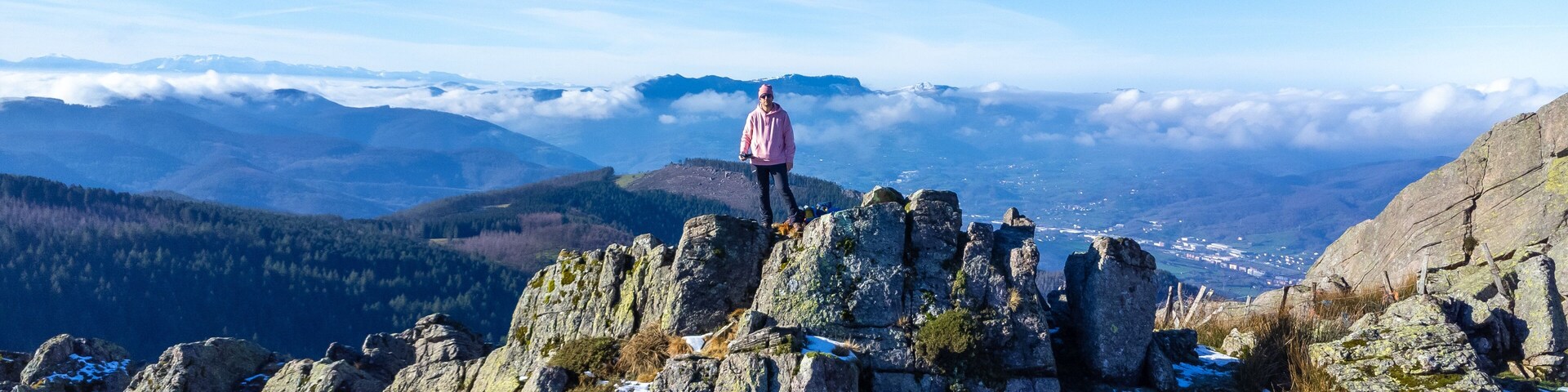 A man at the top of Mount Adarra, municipality of Urnieta in Gipuzkoa. Basque Country