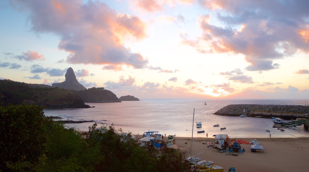 Santo Antonio Port showing general coastal views, a sandy beach and a sunset