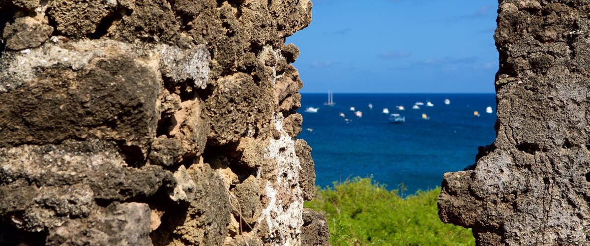 Santo Antonio Fort Ruins featuring heritage elements, building ruins and general coastal views