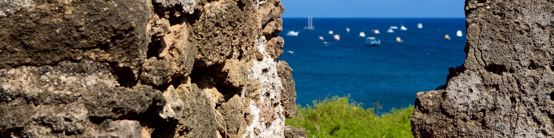 Santo Antonio Fort Ruins featuring heritage elements, building ruins and general coastal views