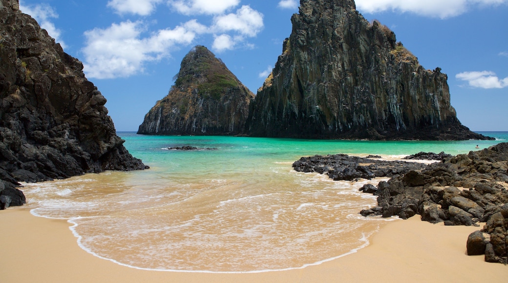Dois Irmaos Hill showing general coastal views, mountains and a beach