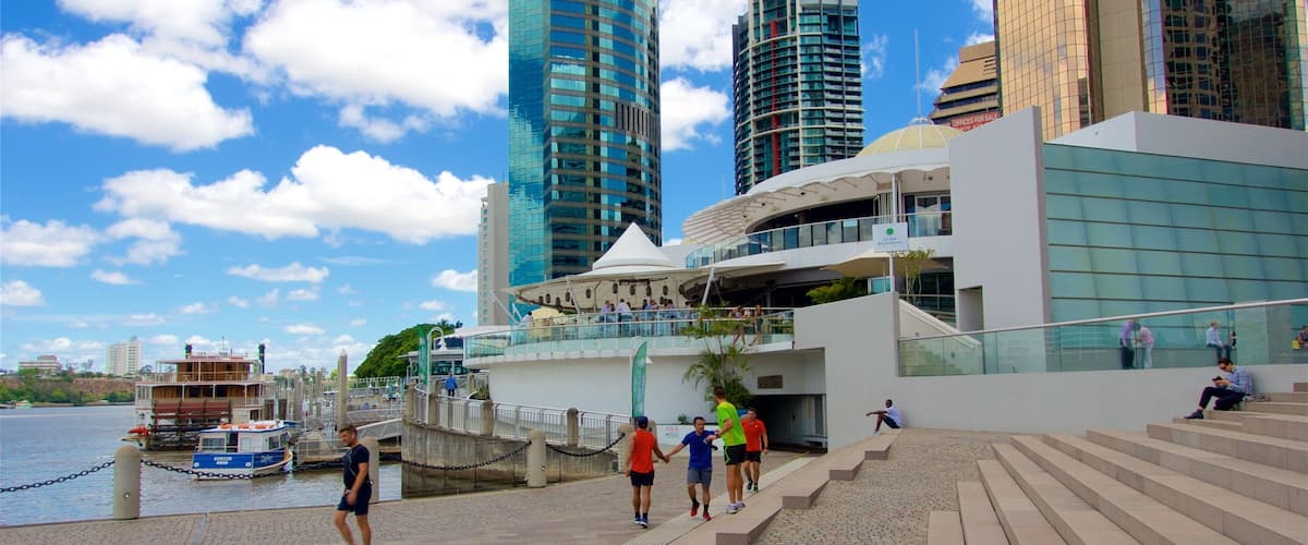 Eagle Street Pier showing a skyscraper, a city and a river or creek
