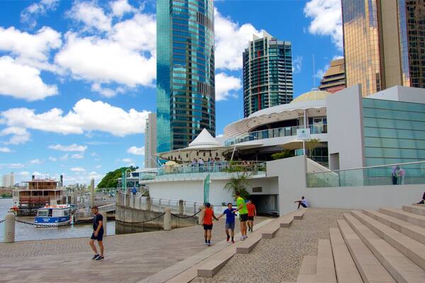 Eagle Street Pier showing a skyscraper, a city and a river or creek