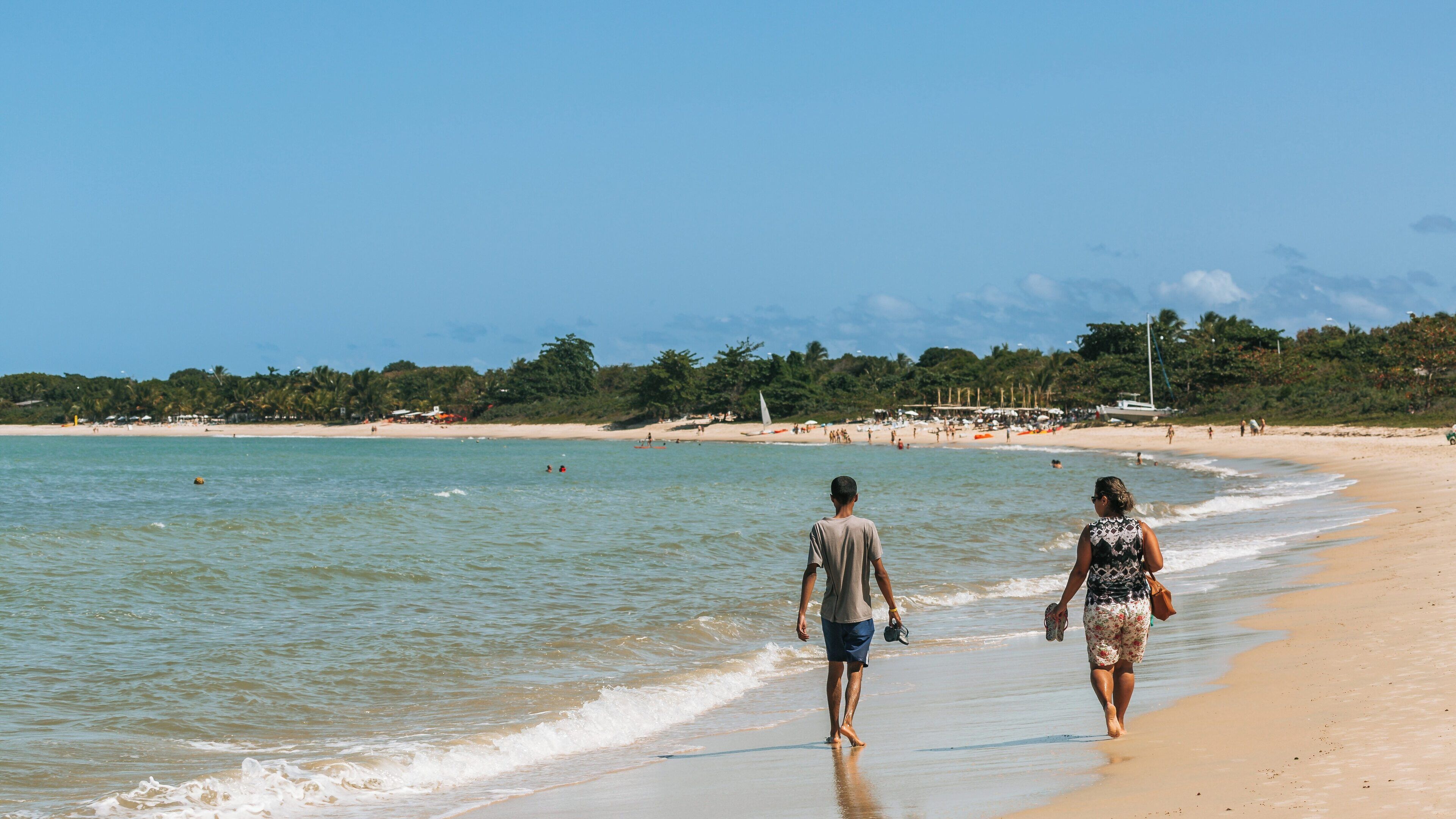 Strolling along Muta Beach in Coroa Vermelha, Porto Seguro, Bahia, Brazil during a sunny day