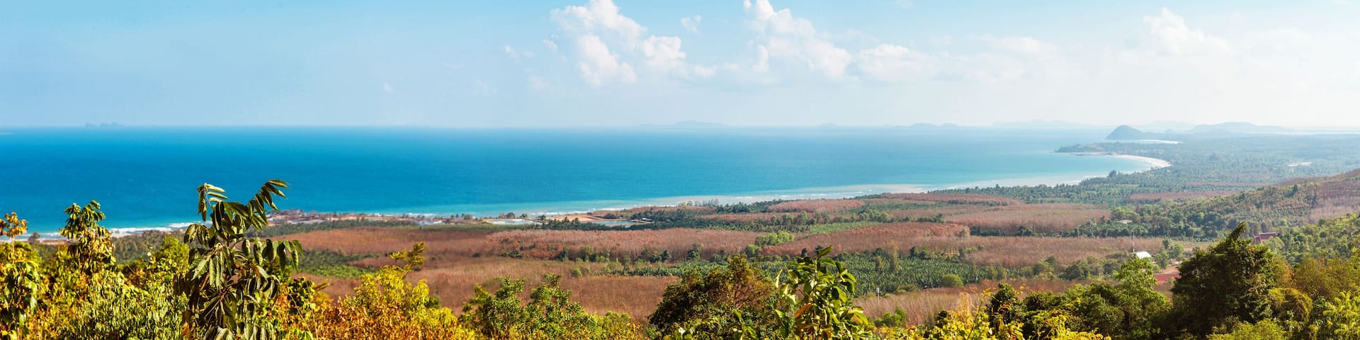 Viewpoint on Chumphon coastline from Buddha gold statue at Wat Khao Chedi-Phra Yai temple located on top of hill, Pathio, Chumphon district, Thailand