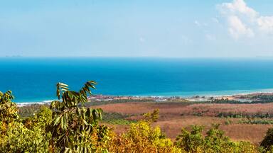 Viewpoint on Chumphon coastline from Buddha gold statue at Wat Khao Chedi-Phra Yai temple located on top of hill, Pathio, Chumphon district, Thailand