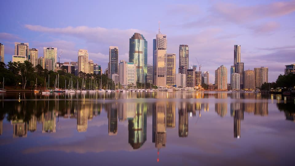 Kangaroo Point Cliffs featuring a sunset, a high rise building and skyline