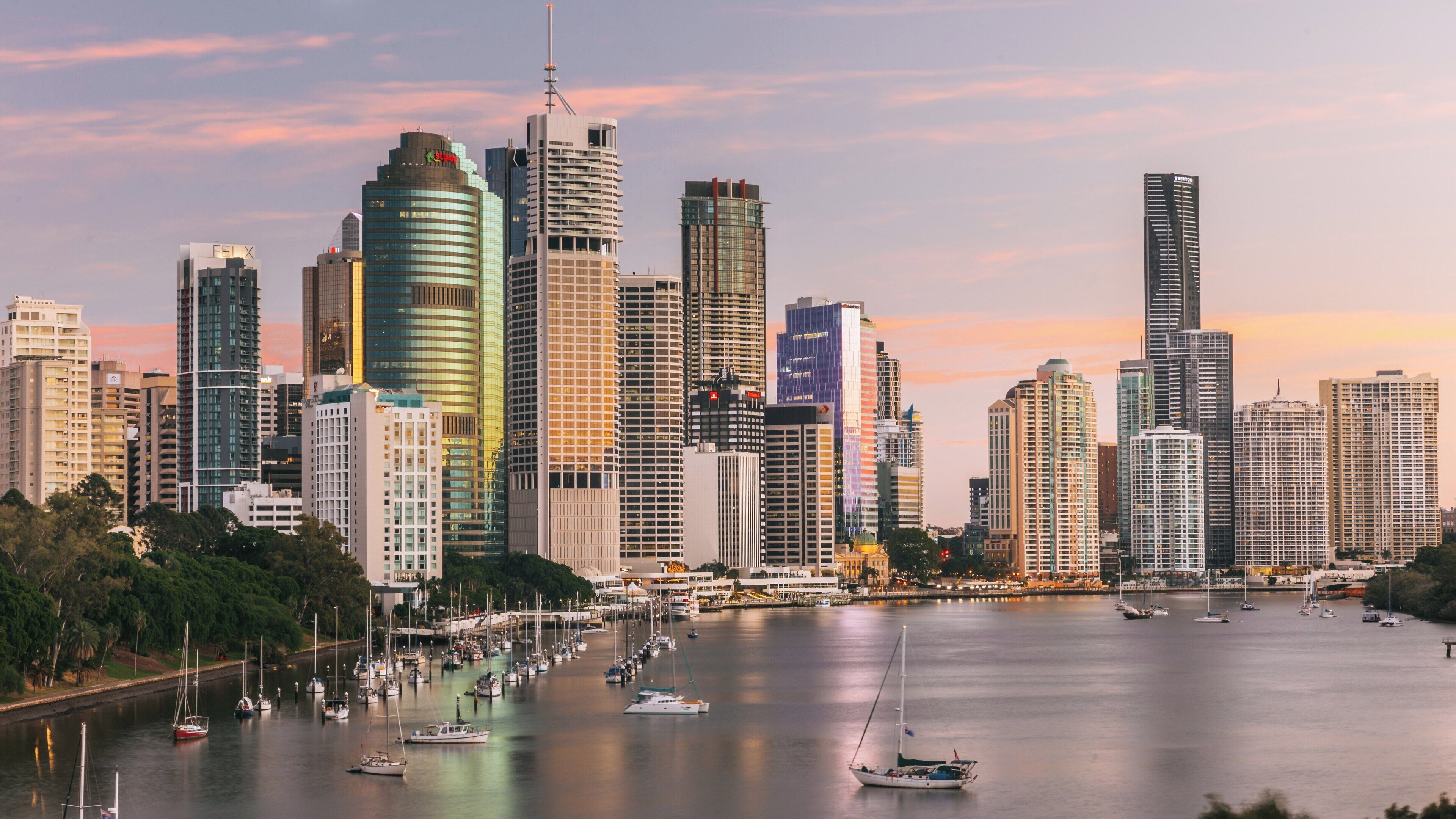 View of Kangaroo Point Cliffs and Brisbane skyline during sunset showcasing city life and natural beauty