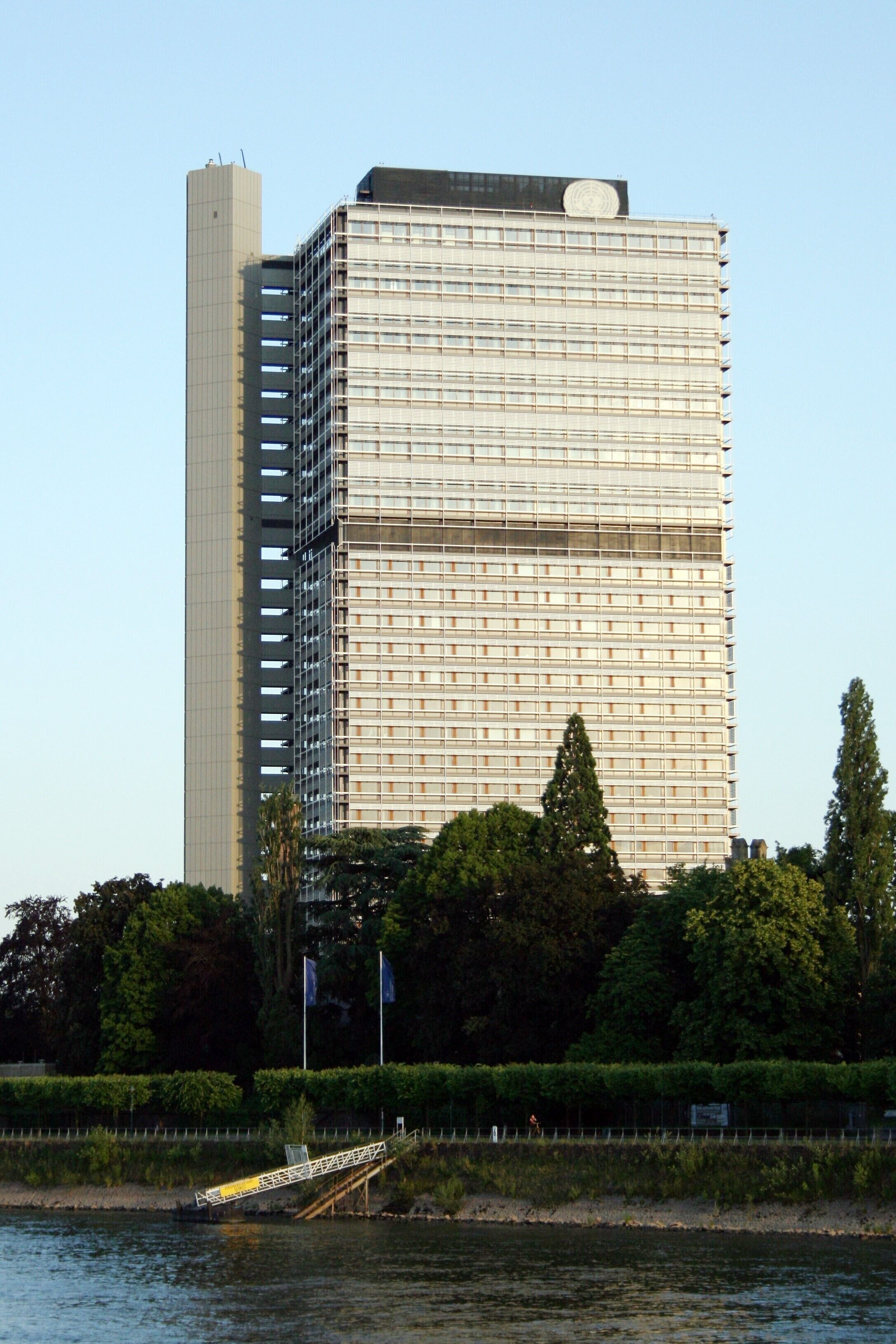 The former house with bureaus used by the members of german parliament (german "Bundestagshochhaus") in Bonn, called "Langer Eugen" —named after Eugen Gerstenmaier; a former president of german parliament (Bundestag) from 1954 until 1969— at Rhein waterside. Now used by employees of some international organisations under the head of the United Nations with there logo on the top of the building.