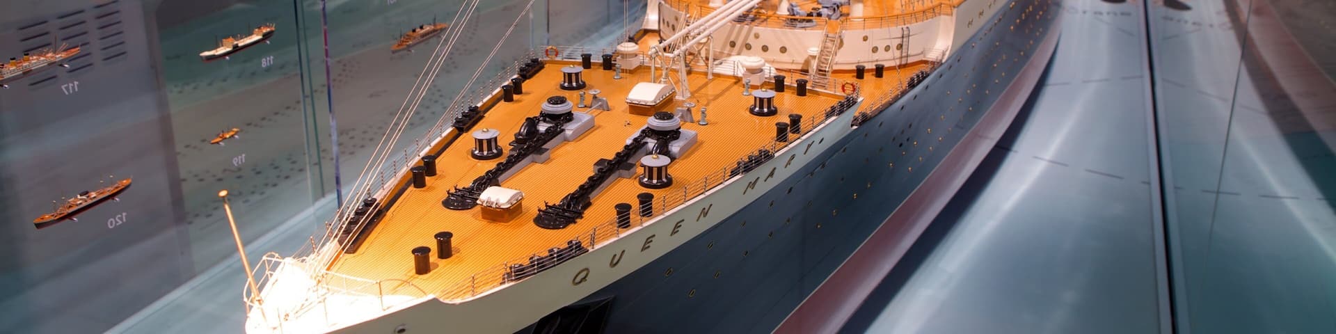 A detailed model of the Titanic in a museum display.