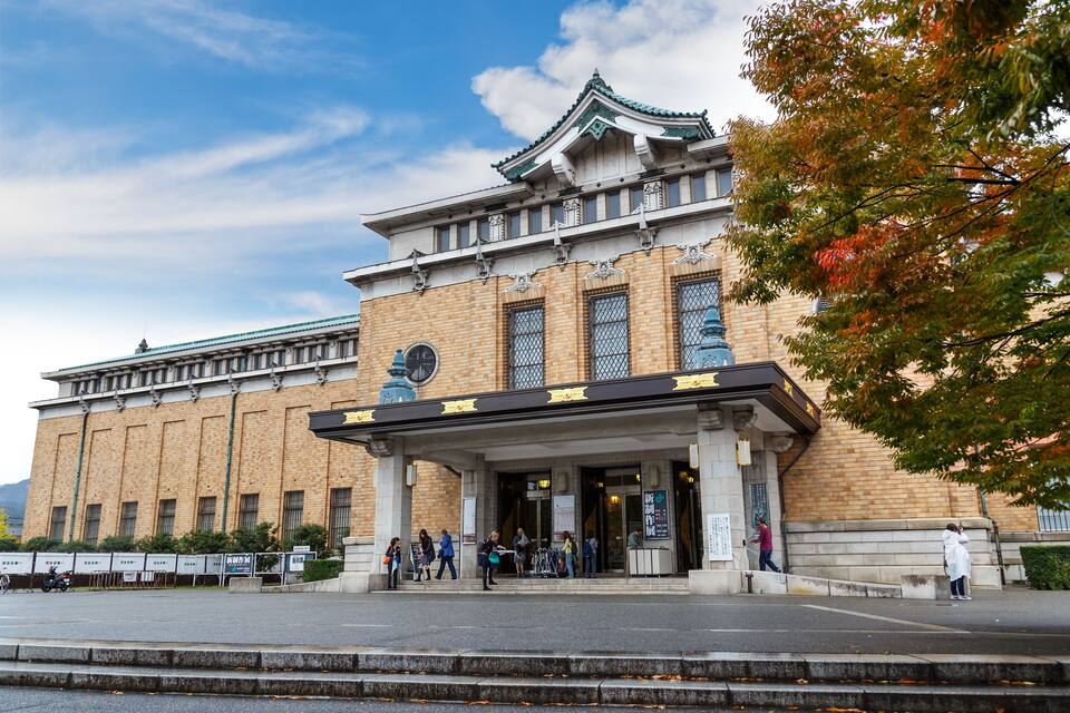 A traditional building with a tiled roof and a large entrance.