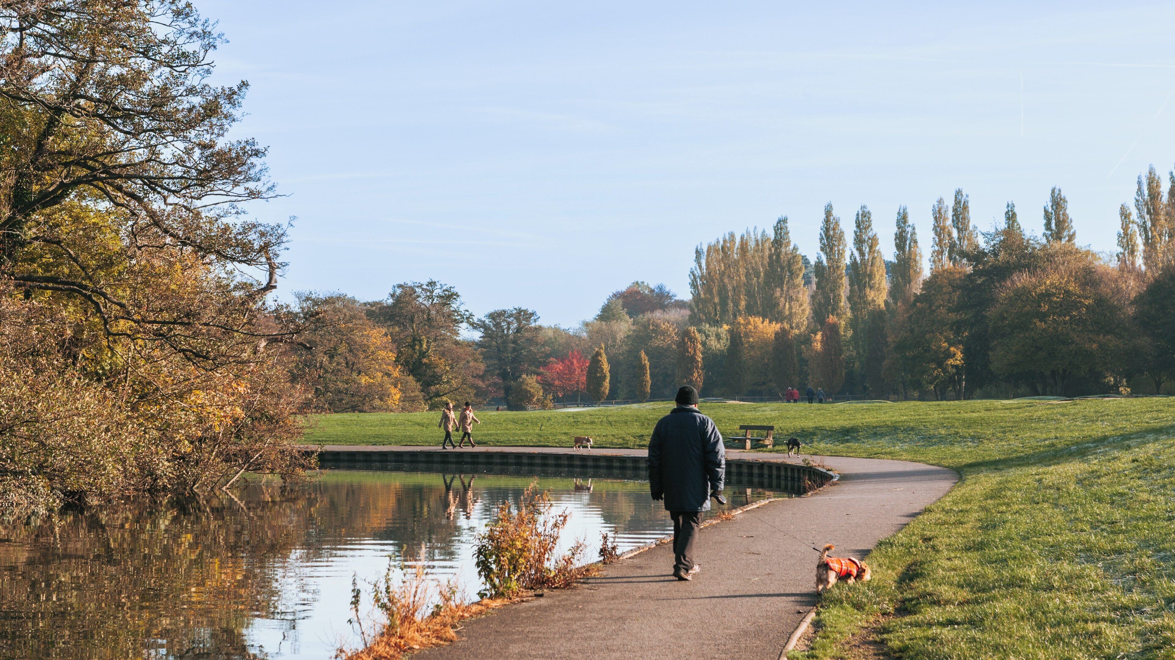 Strolling along the serene riverbank in Riverside Park, Southampton, showcasing the beauty of nature in early autumn