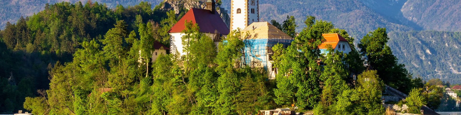 Church on island reflected in waters of Bled Lake