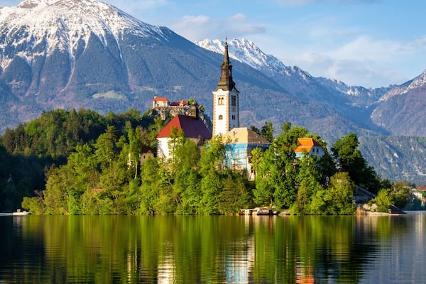 Church on island reflected in waters of Bled Lake
