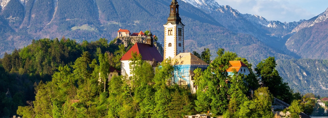 Church on island reflected in waters of Bled Lake