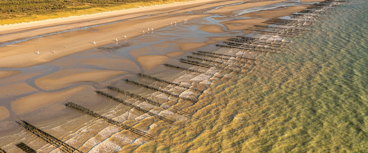 La plage de Quend avec ses bouchots et ses chars-à-voile