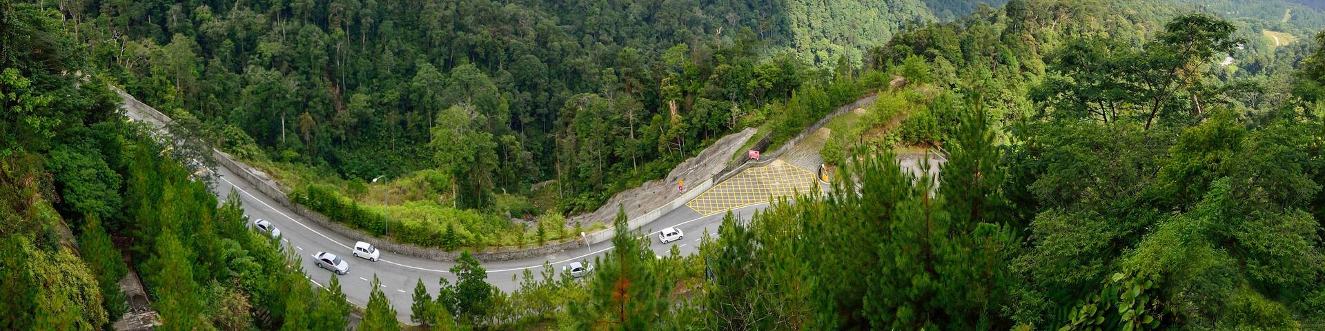Curve road up to the Genting Highlands Malaysia with green tree and sky at Bentong Pahang.