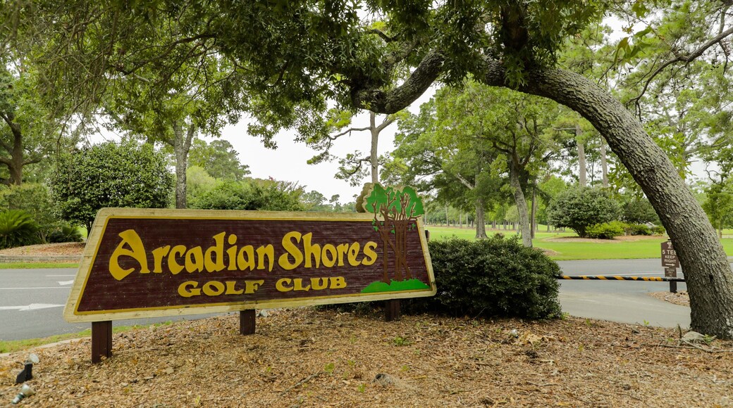 Arcadian Shores Golf Club featuring signage and golf