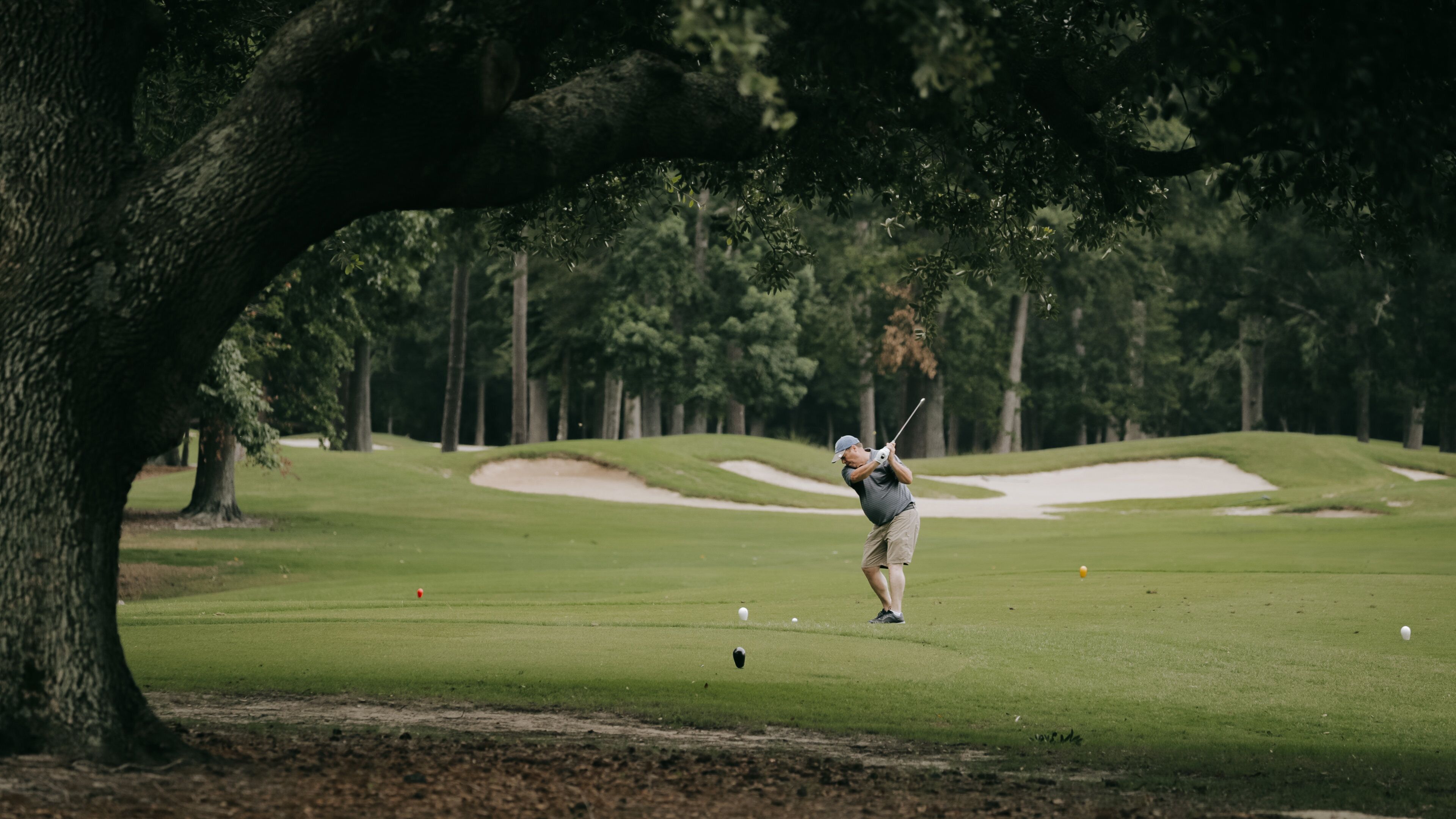Arcadian Shores Golf Club showing golf as well as an individual male
