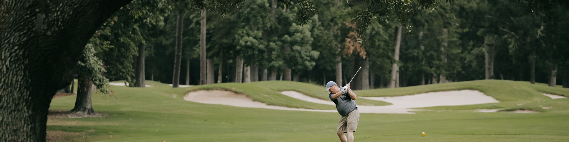 Arcadian Shores Golf Club showing golf as well as an individual male