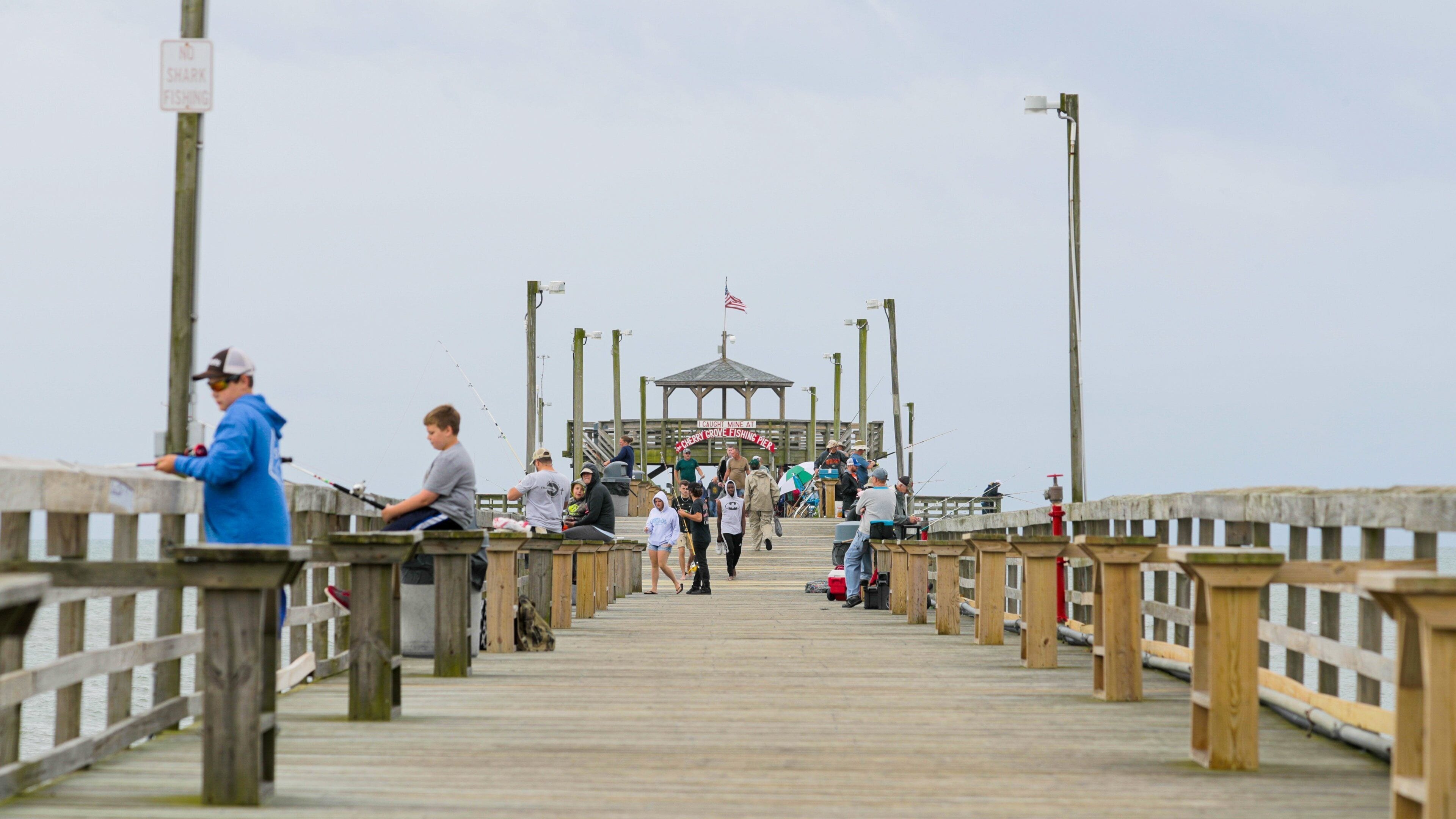 Cherry Grove Pier showing fishing