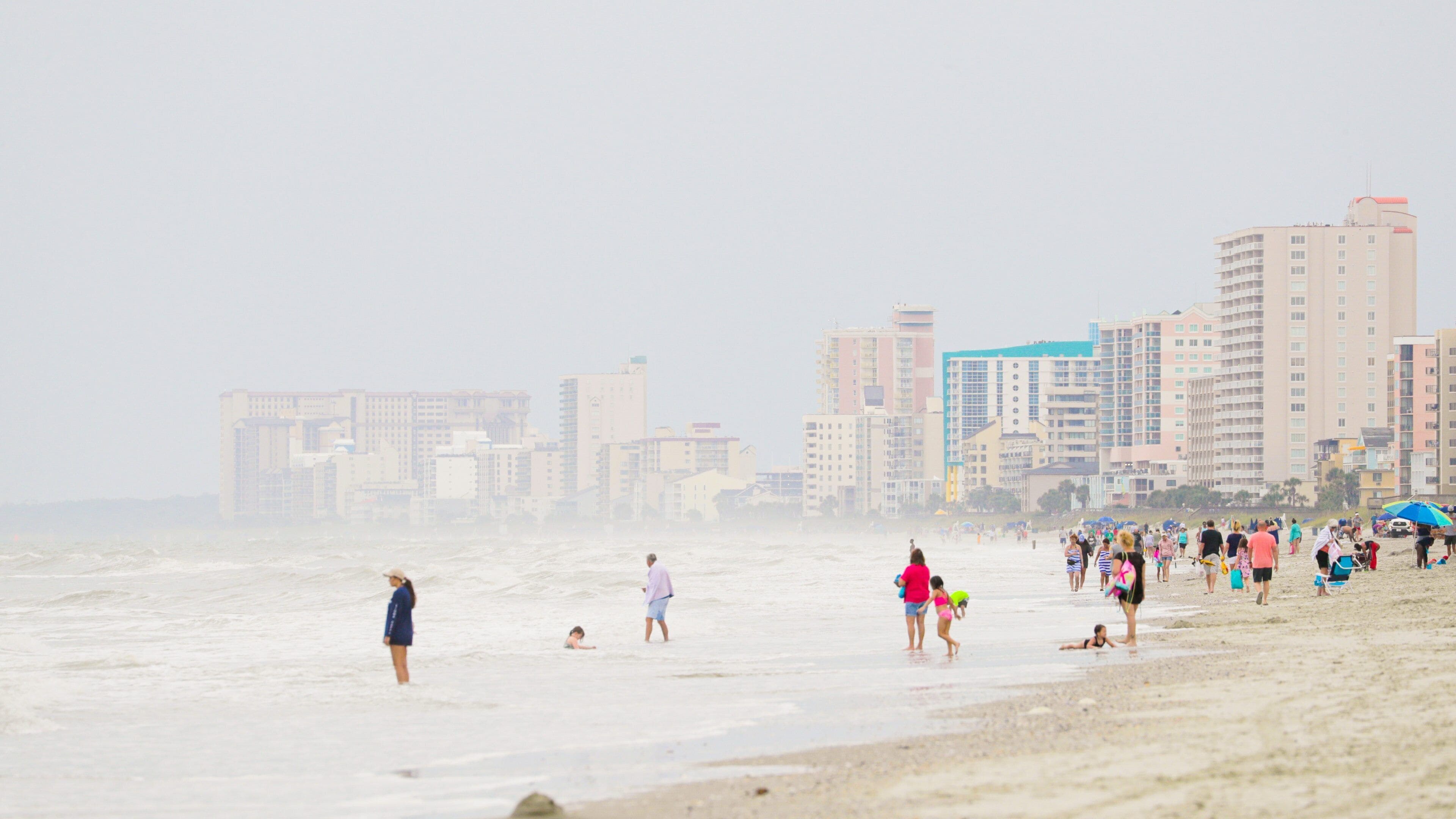 Cherry Grove Pier which includes a sandy beach, a coastal town and general coastal views