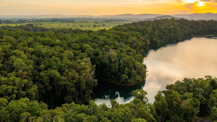 Lake Eacham featuring tranquil scenes, landscape views and a sunset