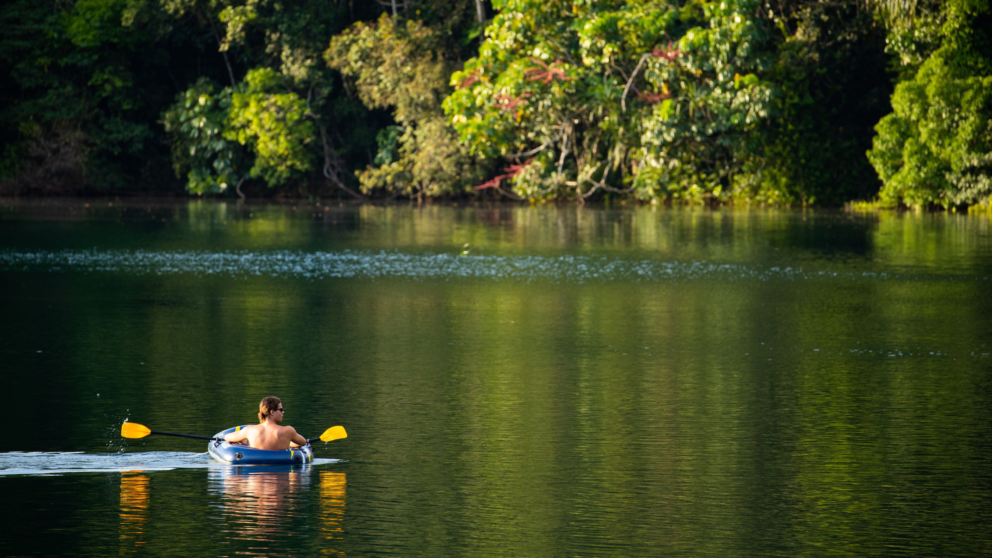 Lake Eacham which includes a lake or waterhole and kayaking or canoeing