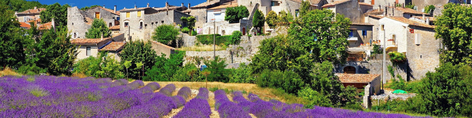 "Lavender field with a small town in Provence - Location: Cereste, Provence, France"