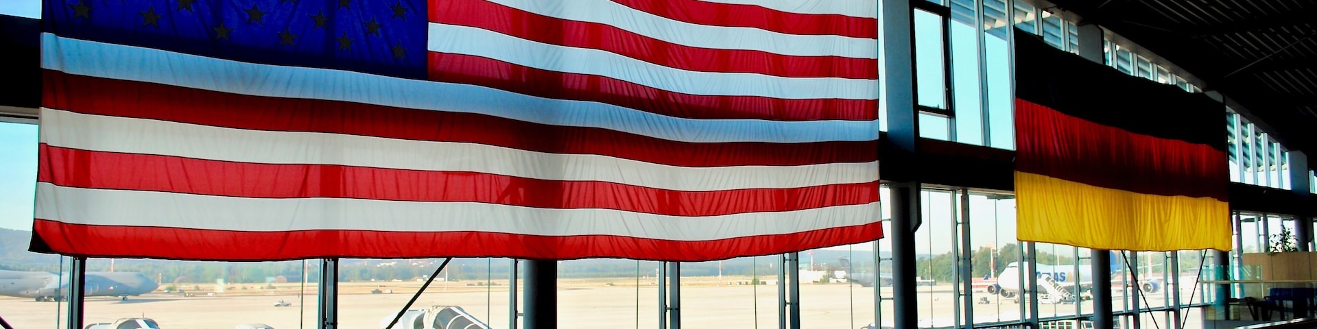 Ramstein, Germany: Ramstein Air Base PAX Passenger terminal. American and German flags hang in the main gateway for the Kaiserslautern Military Community of Americans living in Germany.