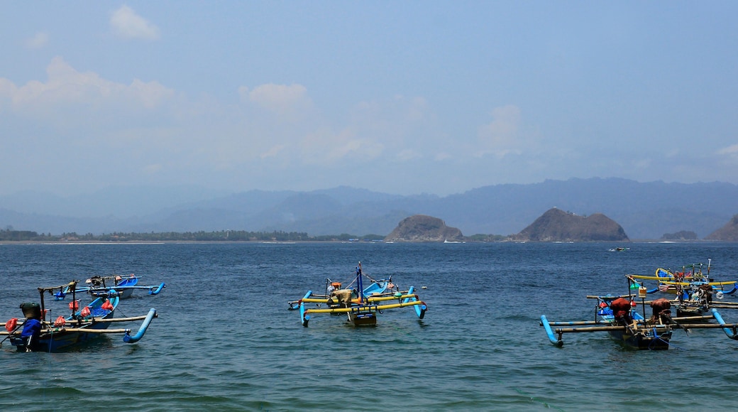 Jember, Indonesia, Sept 12, 2015. Traditional fishing boats sailing over the coastal waters of Tanjung Papuma