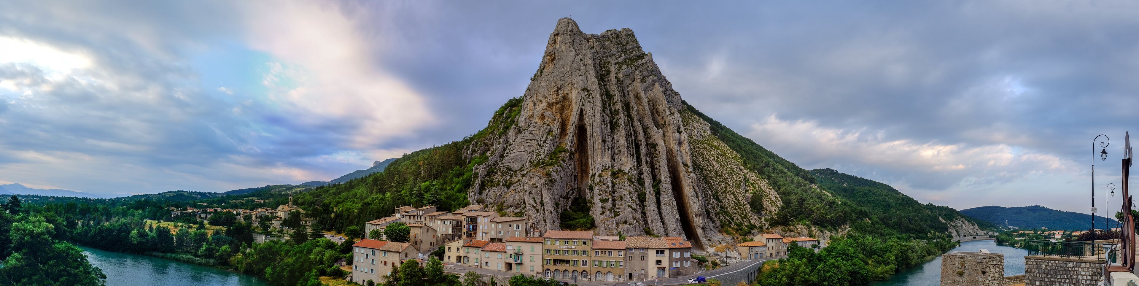 Very large panoramic view of Sisteron on the Durance river, Rocher de la Baume opposite the old town. France