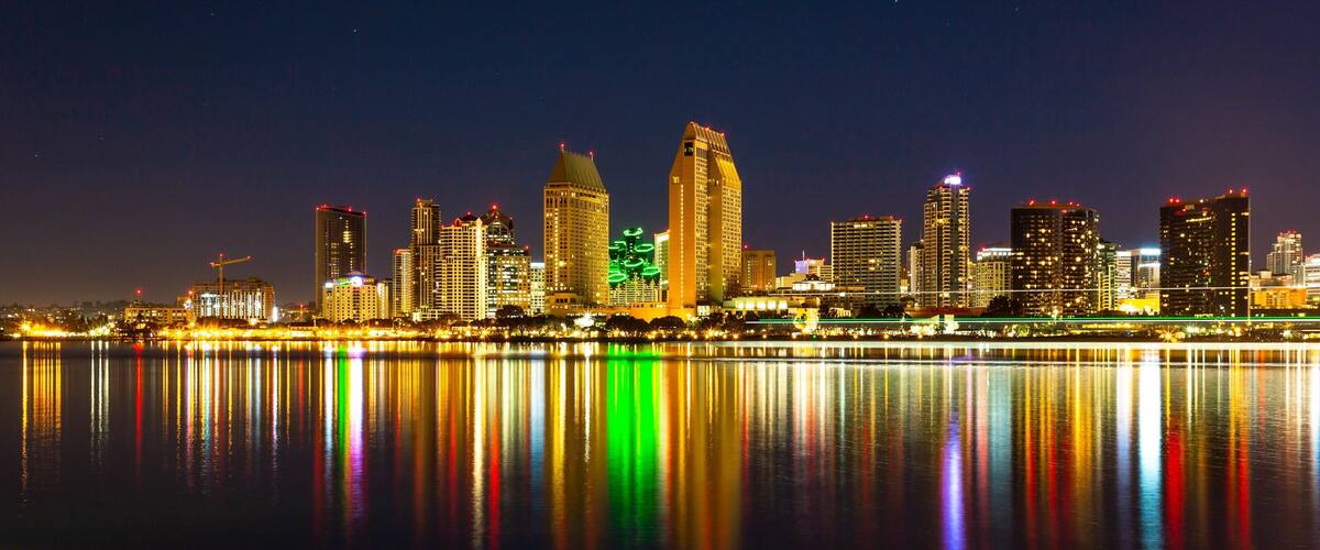 Centennial Park which includes night scenes, a bay or harbor and a city