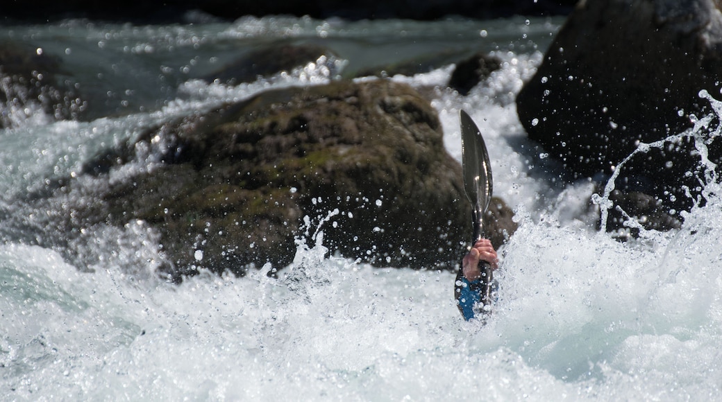 Kayaker playboating at the Rabioux, on the Durance river (France).