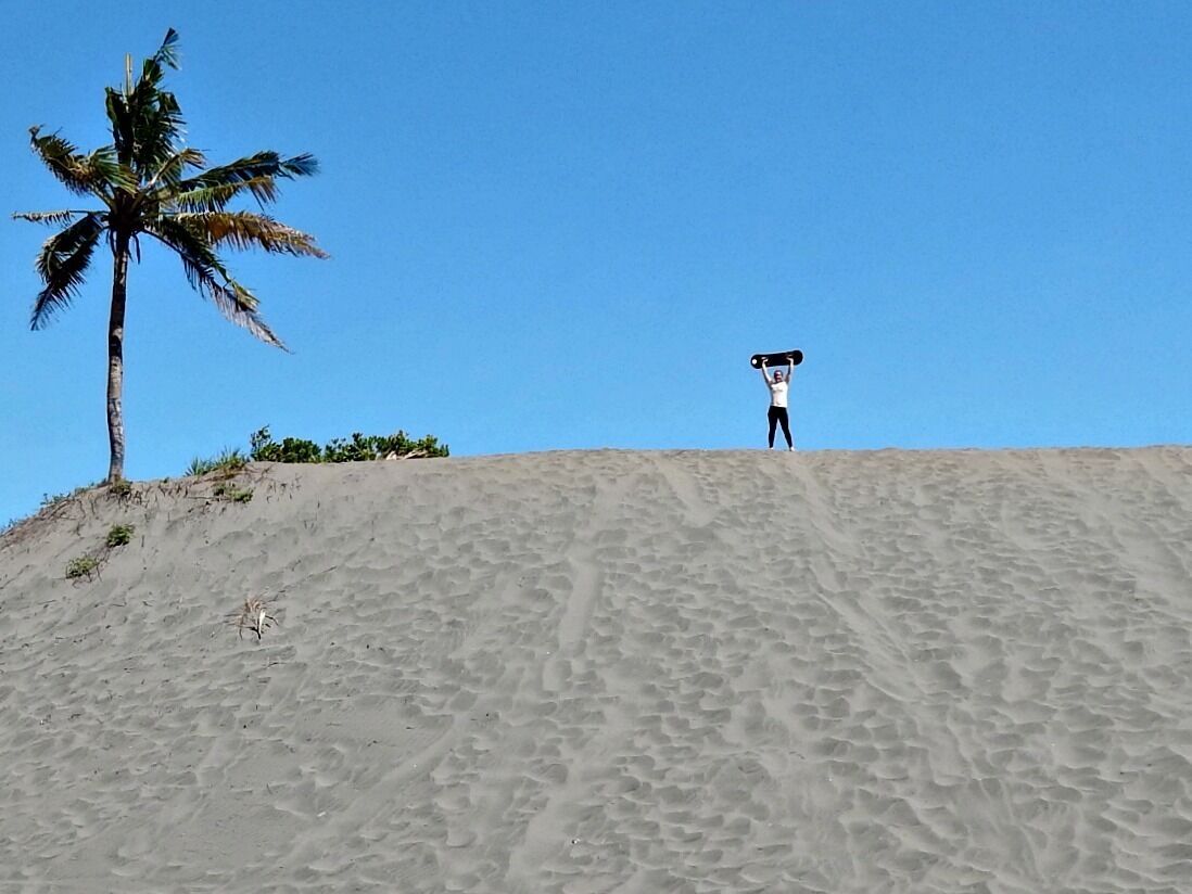 Sandboarding near Jogja! Pantai Parangkusumo has big hills, perfect for sliding down. A woman next door rents the boards and you have the dunes to yourself for however long you want. For two boards, a morning, and a few drinks we paid around $12 usd. We were the only people there. Be warned - go early morning or sunset, because the sand gets scorching hot and is miserable on your feet. Fun -- but also a major workout because you have to re-climb up the dune every time you slide down, and they're steep.  