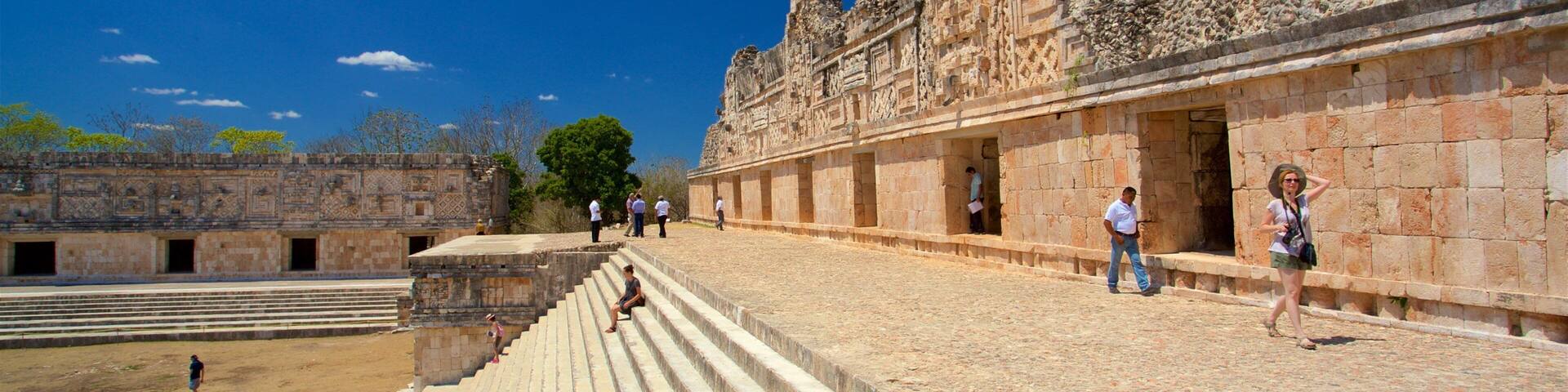 Uxmal Archaeological Site featuring heritage elements as well as a small group of people
