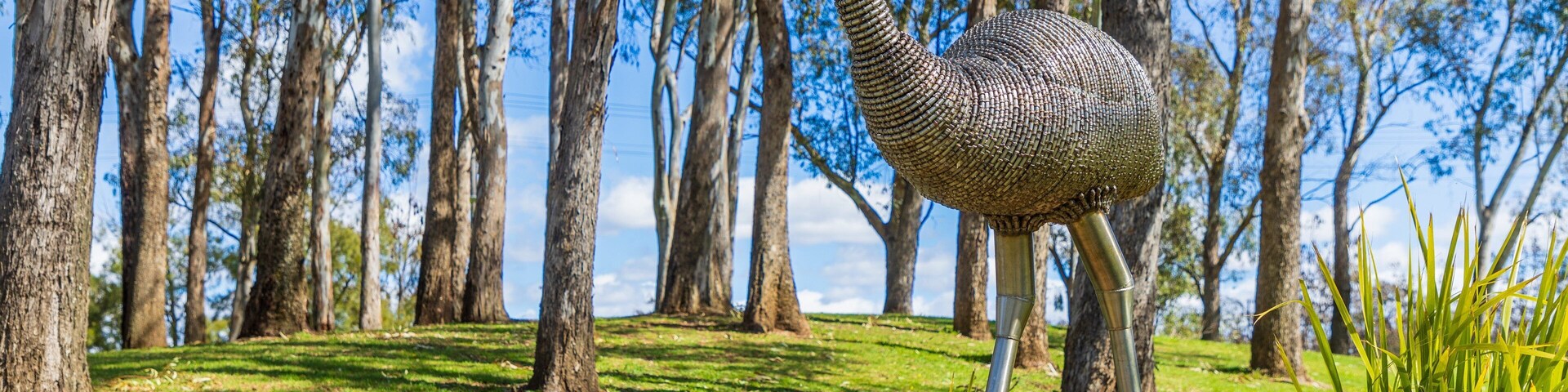 Bicentennial Park featuring outdoor art and a garden