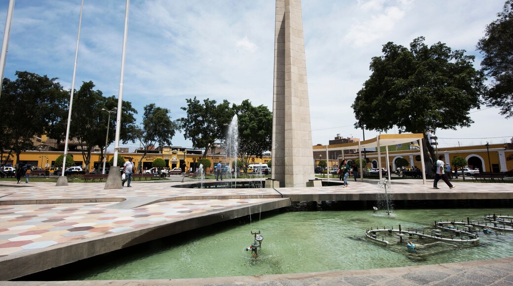 Peru Ica Plaza de Armas with its pyramid sculpture and its water fountain and garden with flowers